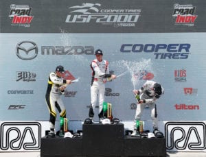 kaylen frederick | pilot one racing | winners podium champagne spray